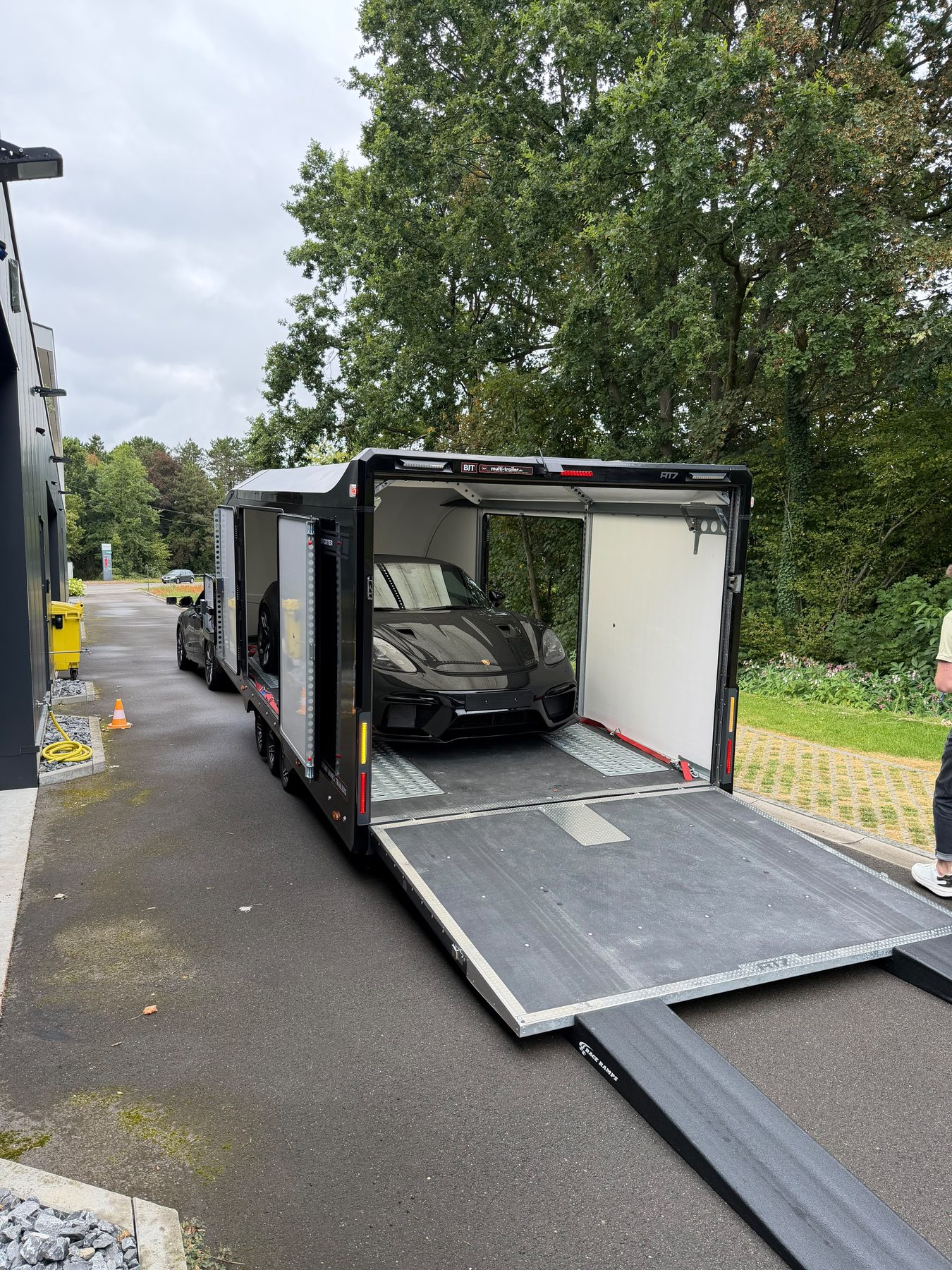 Porsche loaded into an enclosed HVL transport trailer